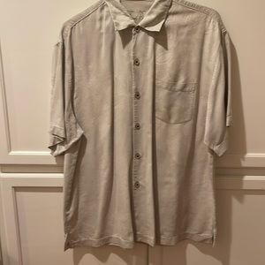Tommy Bahama 100% silk shirt with subtle tropical images.